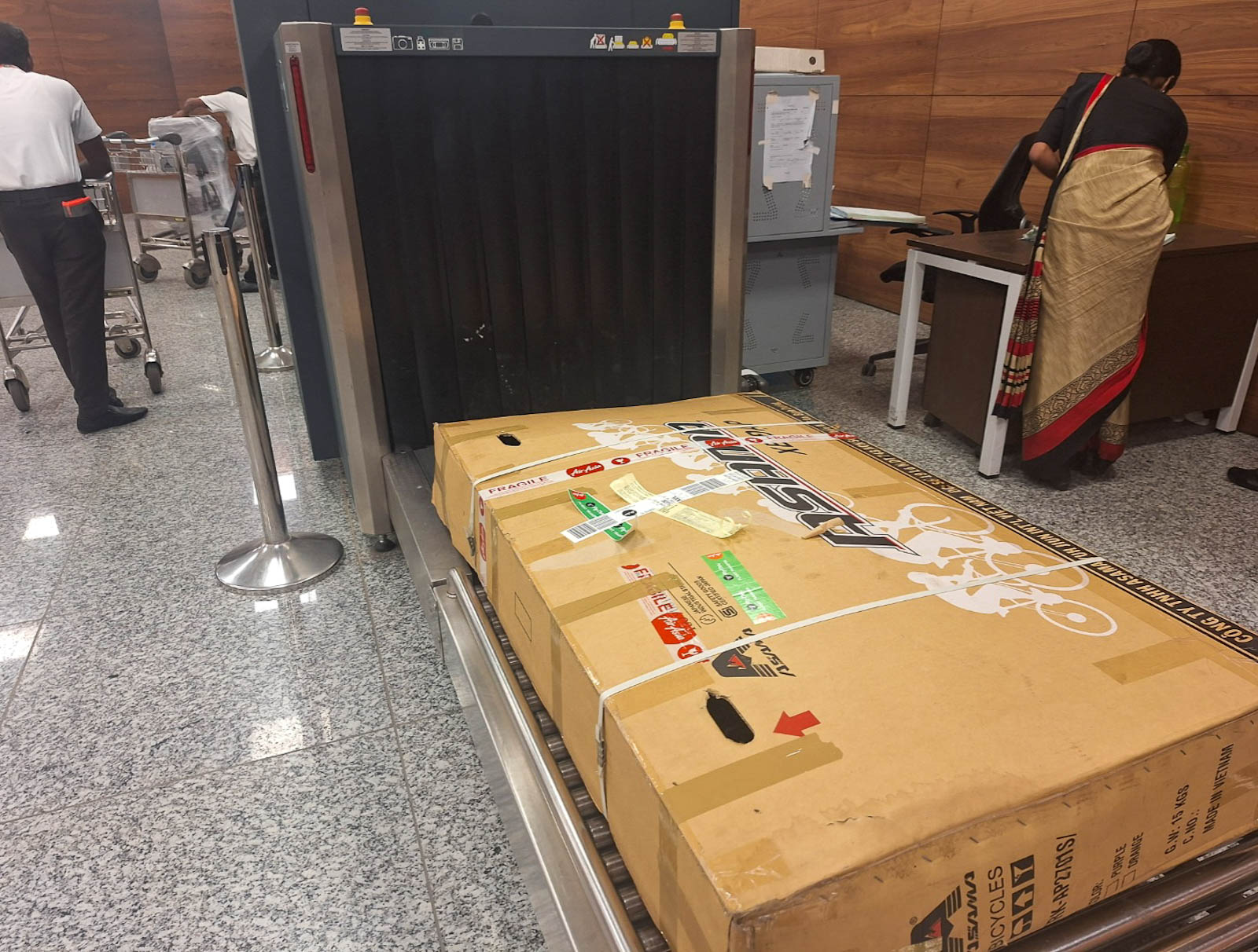 Box with bicycle inside at x-ray check at airport