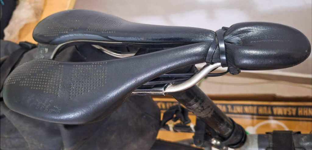 Broken Selle Italia SLR saddle during long-distance bicycle tour