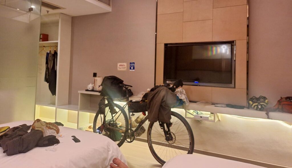 Loaded bicycle in hotel room