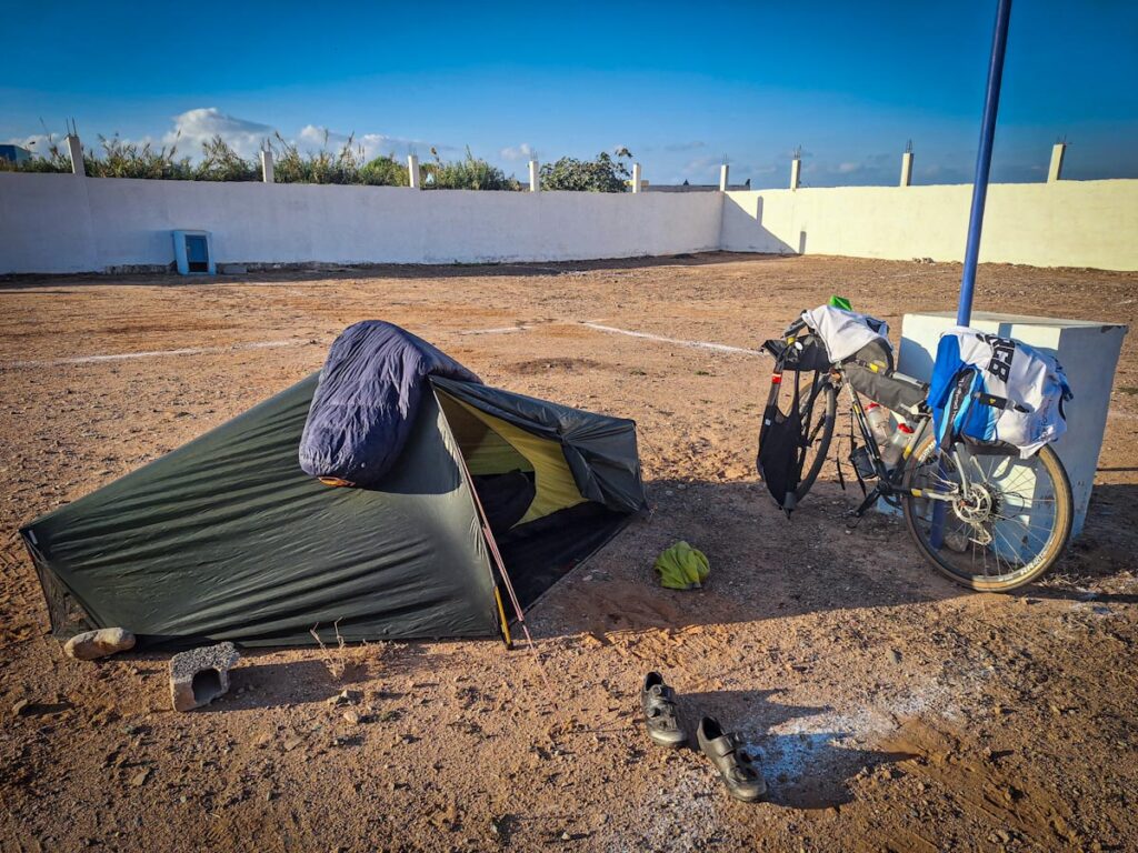 Picture of tent and bicycle with bags on camping ground