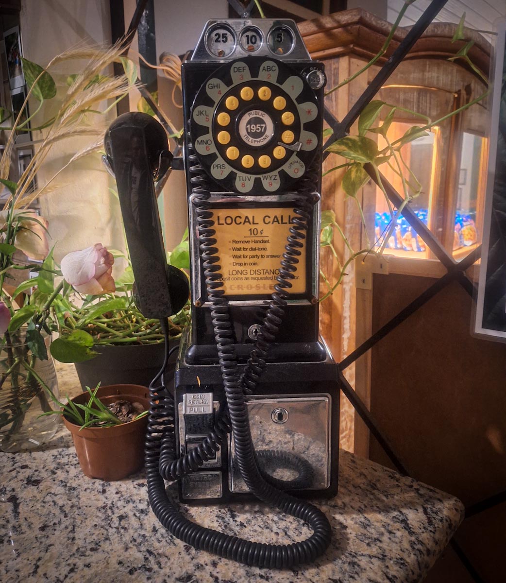 picture of and old telphone with coin operation