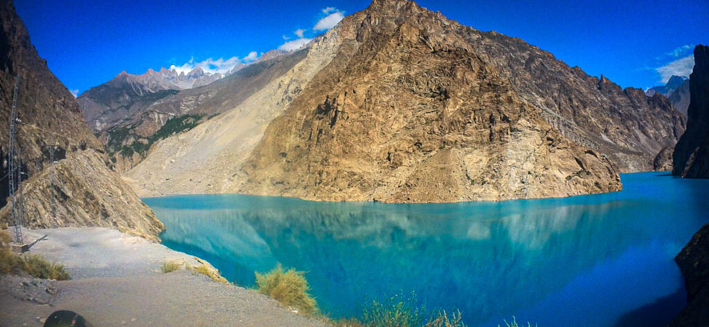 Turquoise waters of Attabad Lake surrounded by steep mountains along the Karakoram Highway